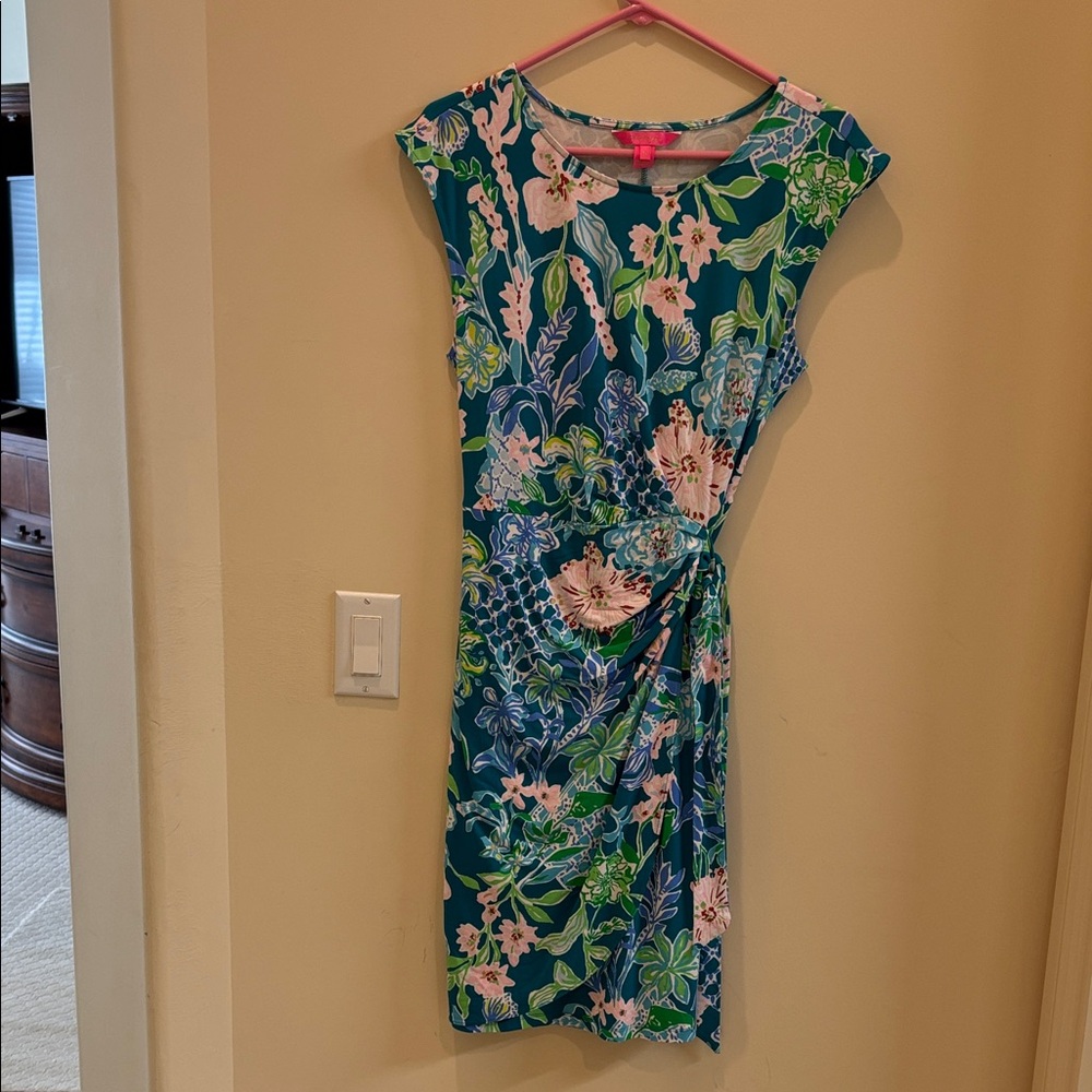 Lilly Pulitzer Teal and Pink Floral Midi Dress hits just below the knee.